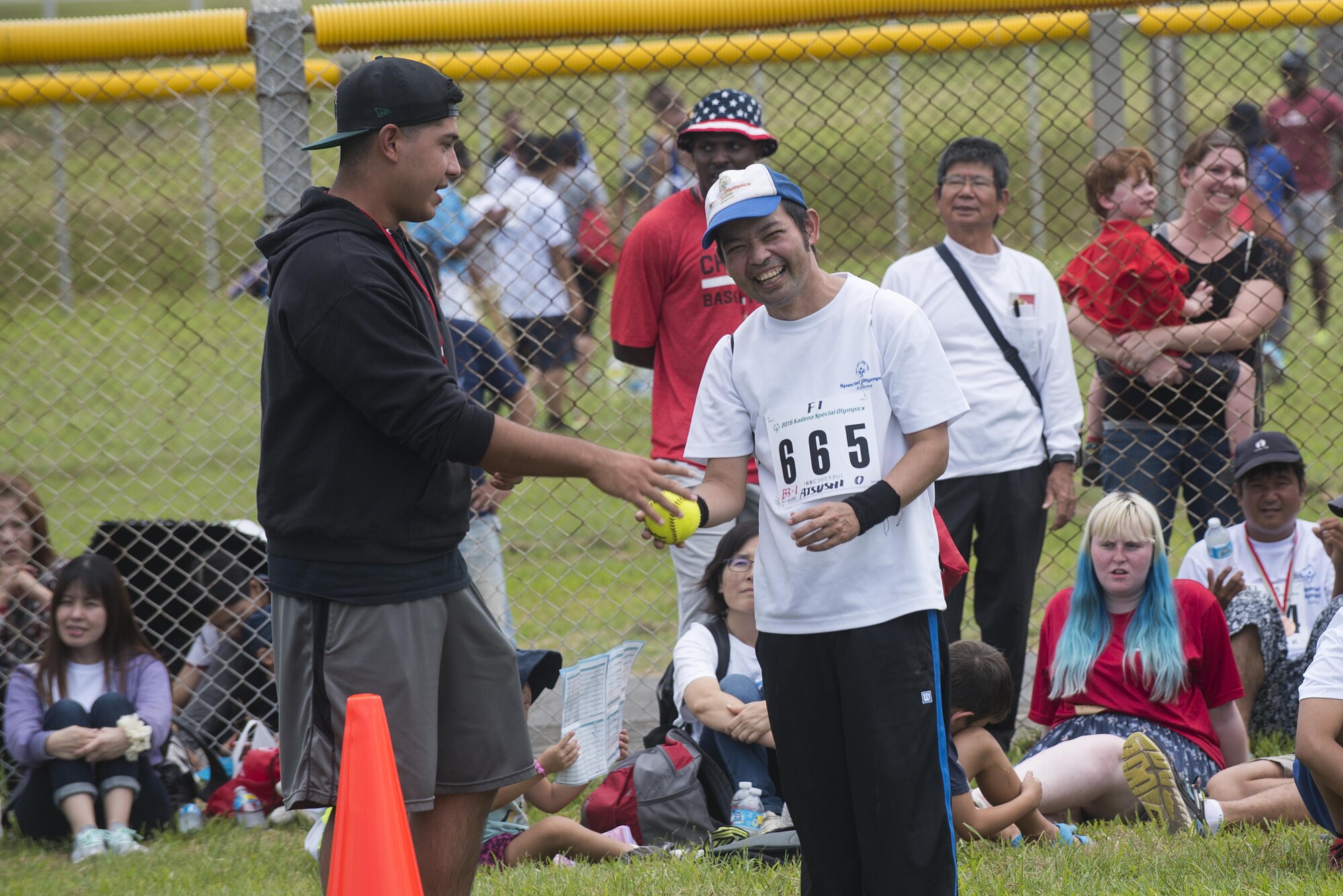 Atsushi Oshiro, Kadena Special Olympics athlete, prepares to throw a softball Nov. 5, 2016, at Kadena Air Base, Japan. The KSO began in 2000 with approximately 400 athletes and 600 volunteers as an 18th Wing community goodwill initiative to strengthen U.S. - Okinawa relationships. After 17 years, the event has more than doubled in size and participation. (U.S. Air Force photo by Airman 1st Class Corey M. Pettis/Released)