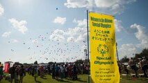 Event participants release balloons into the air to signal the start of the Kadena Special Olympics main event Nov. 5, 2016, at Kadena Air Base, Japan. The goal of KSO is to break down social barriers and create an environment of understanding and acceptance among U.S. and Japanese citizens living together on Okinawa. (U.S. Air Force photo by Senior Airman Peter Reft/Released)