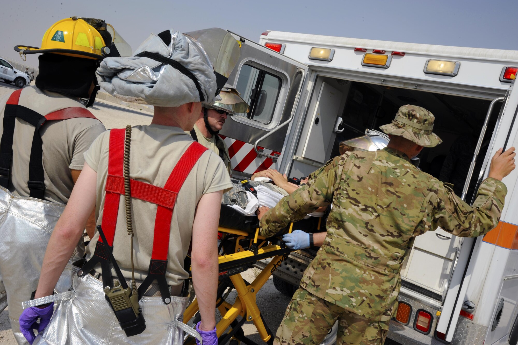 379th Expeditionary Medical Group Airmen load a simulated victim into an ambulance during an antiterrorism training exercise at Al Udeid Air Base, Qatar, Nov. 3, 2016,. The purpose of the training exercise was to test procedures that are in place to ensure the safety of base personnel. (U.S. Air Force photo by Senior Airman Cynthia A. Innocenti)