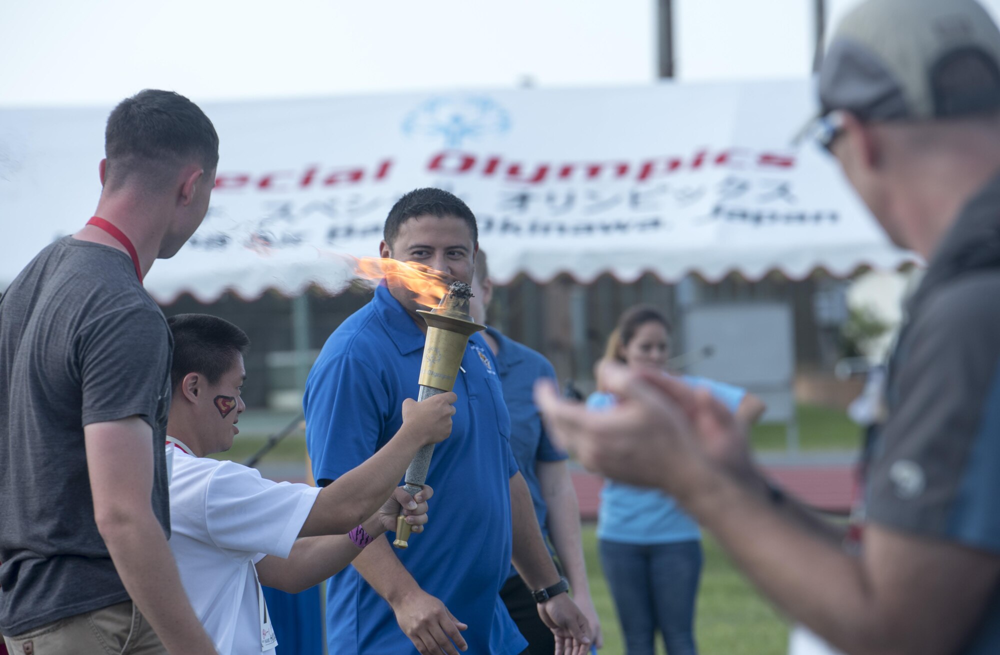 Hiroyuki Urasaki, Kadena Special Olympics athlete, carries the torch symbolizing the end of this year’s Kadena Special Olymics Nov. 5, 2016 at Kadena Air Base, Japan. This year marks the 17th anniversary of KSO, a sporting event dedicated to enriching the lives of American and Okinawan special needs individuals on the island. (U.S. Air Force photo by Senior Airman Omari Bernard/Released)