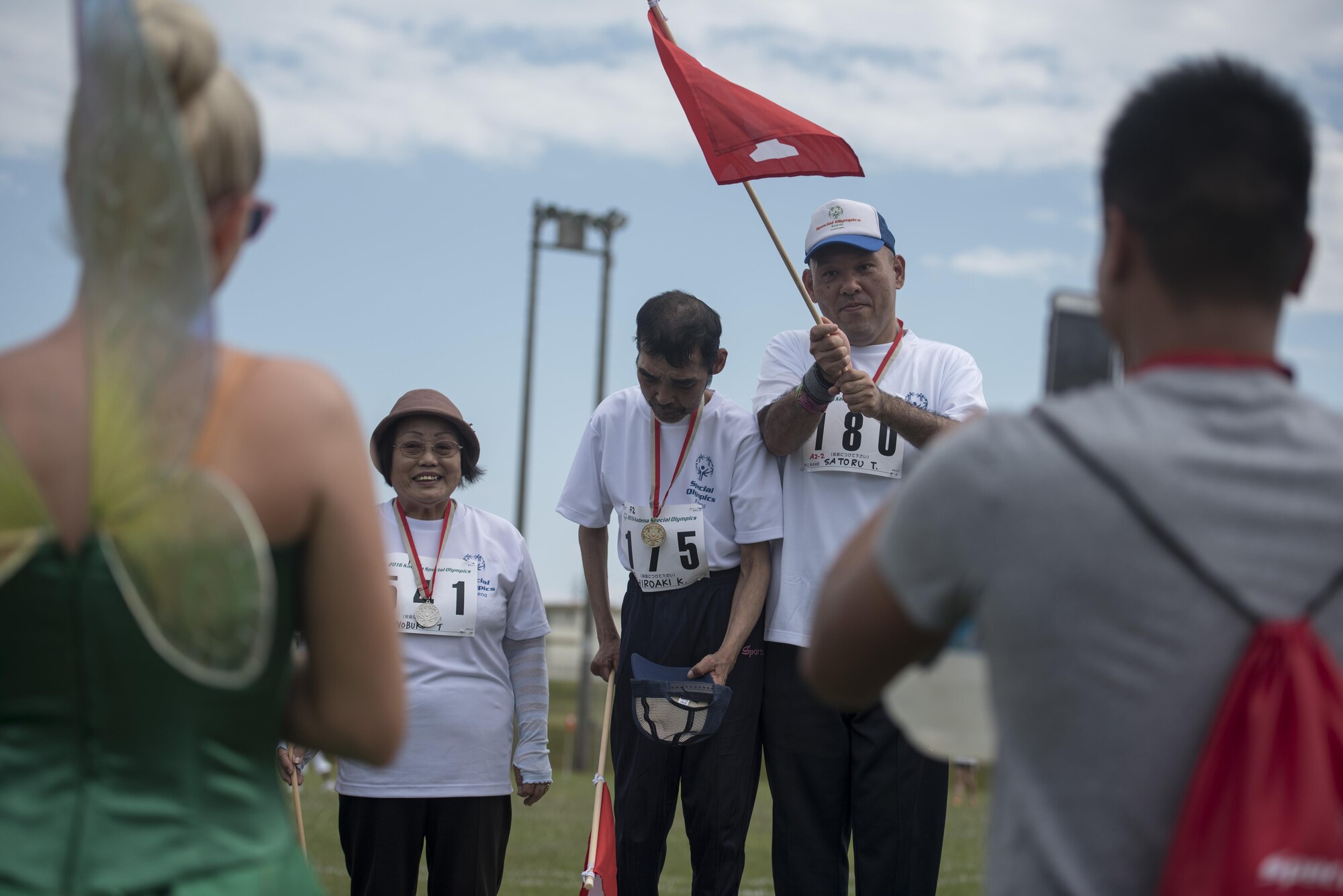Kadena Special Olympians receive accolades after medaling in the Kadena Special Olympics Nov. 5, 2016 at Kadena Air Base, Japan. The Kadena Special Olympics is the largest community outreach event of the year in the Pacific Theater partnering nearly 1,000 volunteers with almost 900 special needs athletes competing in more than 50 events. (U.S. Air Force photo by Senior Airman Omari Bernard/Released)