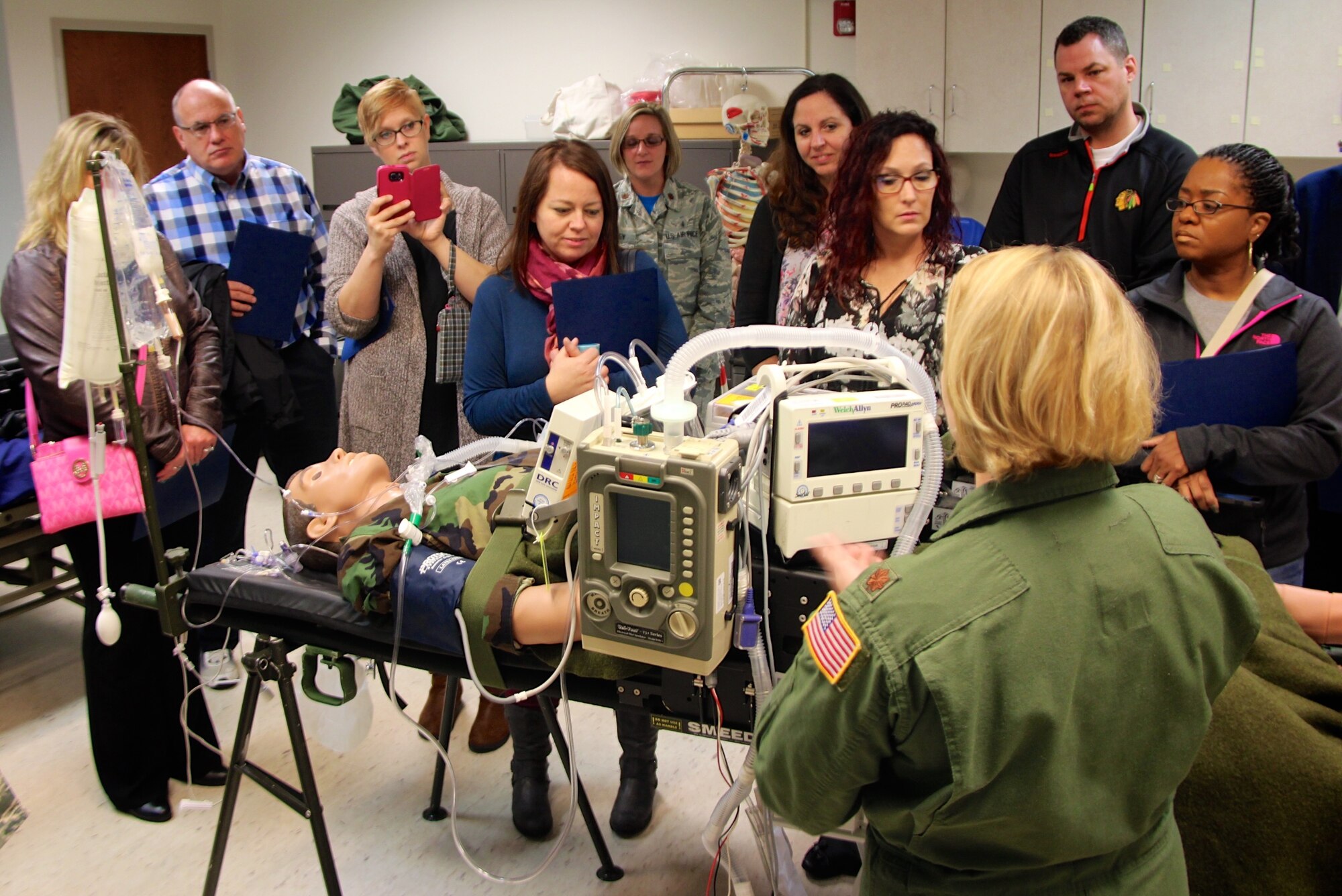 Maj. Patricia Wilkinson, 932nd Medical Group, speaks to bosses about trauma during a simulation patient treatment session.  932nd Airlift Wing medical staff welcomed employers of 932nd Airlift Wing members to the "Boss Day" event.  They received a first-hand look at not only real world medical issues, but also the varied missions of the Wing during Boss Day, November 5, 2016. Among other things, they were treated to a security dog demonstration, a trip to the control tower,  civil engineers, fire fighting, as well as lunch on board one of the unit planes.

Employers heard briefings from public affairs, the 932nd Airlift Wing top enlisted and officer leaders, historian, safety office representative, and learned what the flying mission is about. Bosses also had the opportunity to tour the weather center.

When leaving at the end of the day, the civilian bosses said they were thrilled by the mission and the expertise of the men and women of the 932nd Airlift Wing.  (U.S. Air Force photo by Lt. Col. Stan Paregien)
