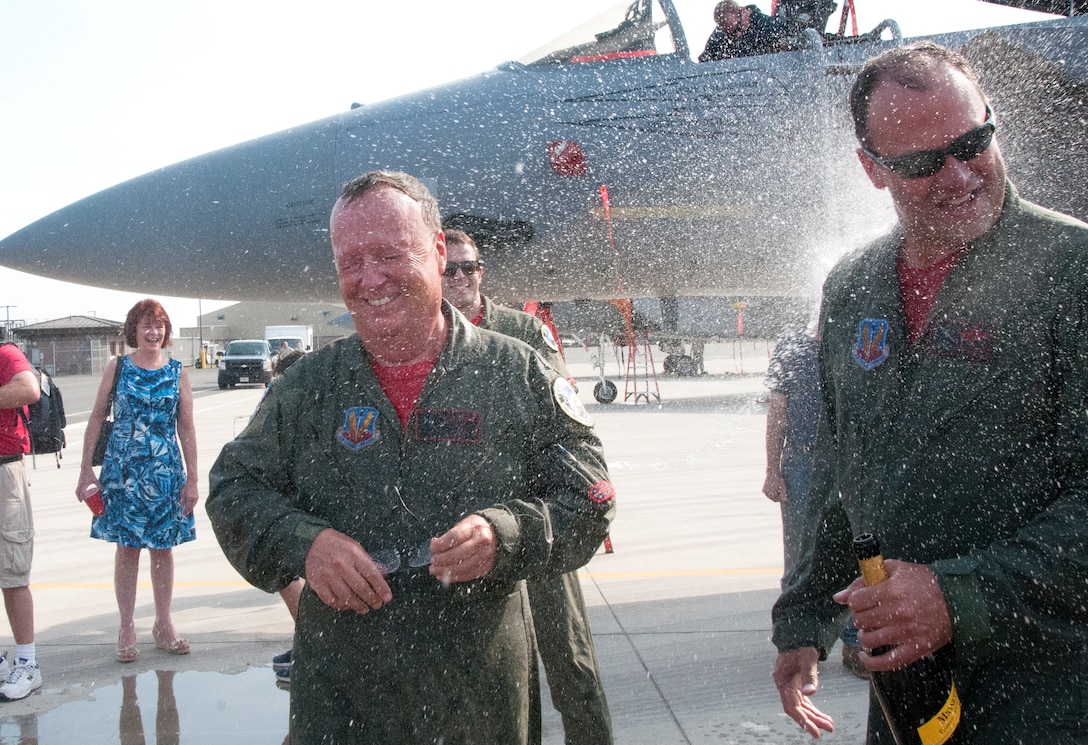 Lt. Col. Joe Monk Keenan, 104th Fighter Wing flight surgeon, and Lt. Col. Ken Hatman Fedora, 104th Fighter Wing F-15 pilot, celebrate the end of their military careers on Sept. 10, 2016, at Barnes Air National Guard Base, Westfield, Mass. (U.S. Air National Guard photo by 1st Lt. Bonnie Harper/released)