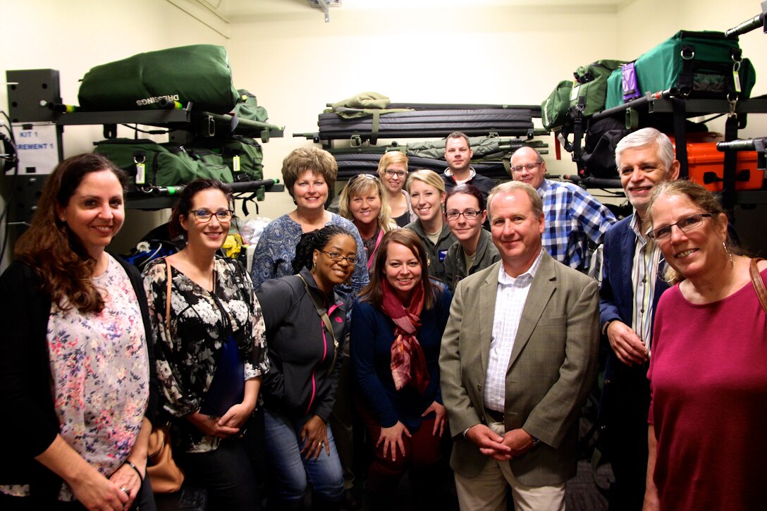 The 932nd Airlift Wing's Aeromedical Evacuation Squadron members Senior Airman Hannan Kreutzer and Staff Sgt. April Richardson (center, second row) enjoyed explaining their AES jobs flying aboard various planes, helping patients in somewhat tight areas, just like this training room showed.  They spoke to these civilian employers who visited the unit during the November Unit Training Assembly.  Employers came from around the Saint Louis region and from as far away as Colorado to see the 932nd Airlift Wing in action November 5, 2016.  (U.S. Air Force photo by Lt. Col. Stan Paregien)