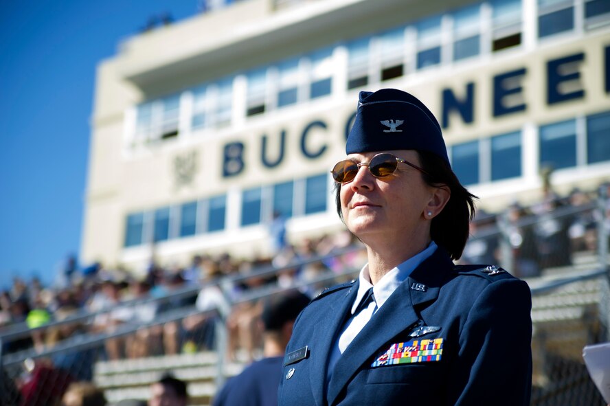 Col. Jeanine McAnaney, 315th Airlift Wing vice commander, participates in the coin toss for the Charleston Southern University football game Nov. 5, 2016, at the CSU Buccaneer stadium. The invitation was extended to the Air Force Reserve wing to honor service members for Veterans Day and reinforce their connection in the community. After the opening ceremonies, McAnaney met with several students, spectators and distinguished guests while enjoying the football game between CSU and Garner-Webb University.