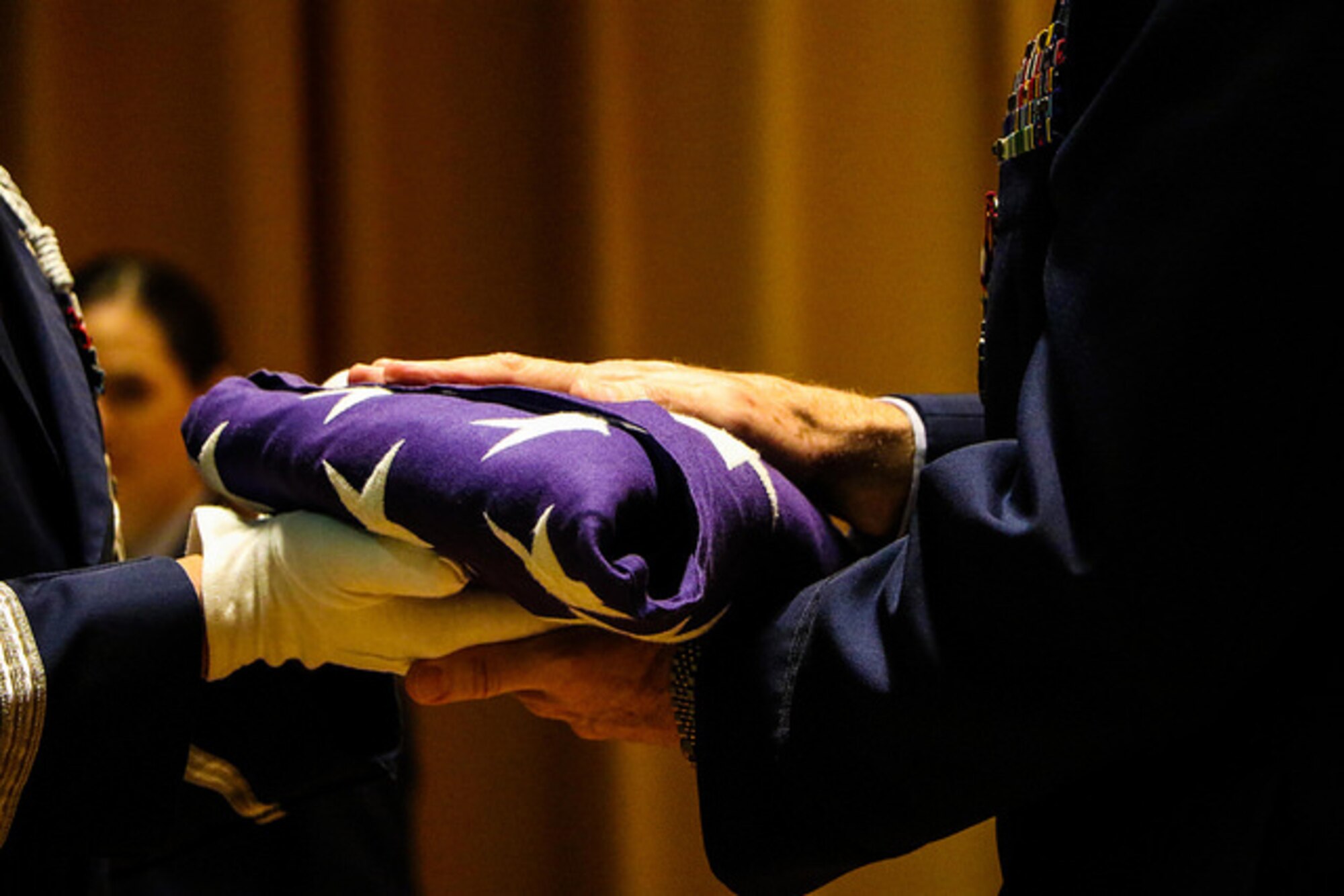 Col. Dennis Seymour 927th Air Refueling Wing Mission Support Group commander, accepts a flag during his retirement ceremony at MacDill Air Force Base, FL Nov. 5, 2016. Seymour served 36 years as a member of the U.S. Air Force Reserve. (U.S. Air Force photo by Senior Airman Xavier Lockley)