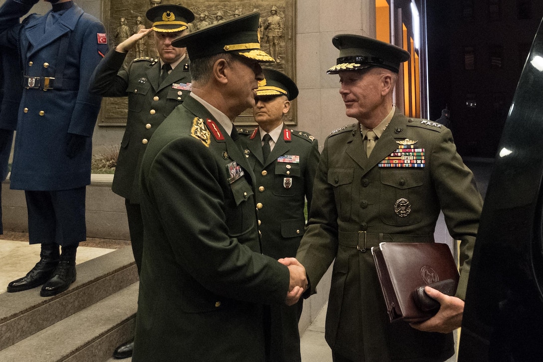 Army Gen. Hulusi Akar, the chief of the Turkish General Staff, bids farewell to Marine Corps Gen. Joe Dunford, chairman of the Joint Chiefs of Staff, right, following meetings in Ankara, Turkey, Nov. 6, 2016. DoD Photo by D. Myles Cullen