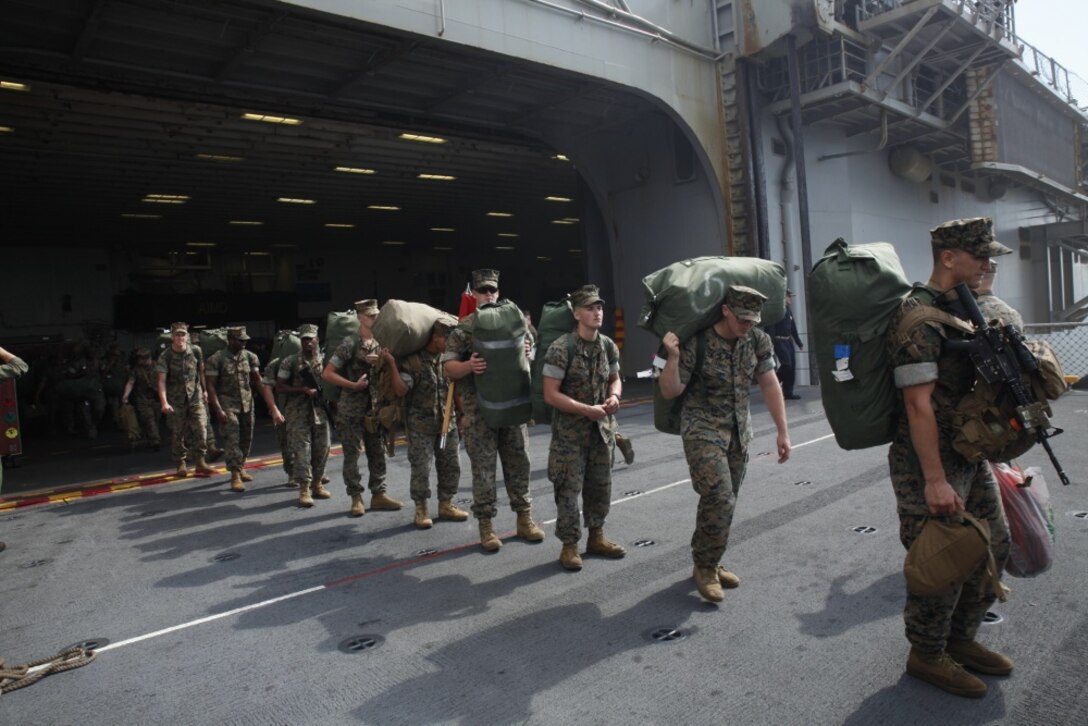 U.S. Marines wait aboard the USS Bonhomme Richard (LHD 6) before going ashore after returning from their Fall Patrol of the Asia-Pacific region, Oct. 28, 2016. As the Marine Corps’ only continuously forward deployed unit, the 31st Marine Expeditionary Unit is prepared to respond to a wide range of military operations, from humanitarian assistance missions to limited combat operations, at a moment’s notice. As a balanced air-ground-logistics team, the 31st MEU is ready to respond throughout the Asia-Pacific region. (U.S. Marine Corps photo by Lance Cpl. Amy Phan) 