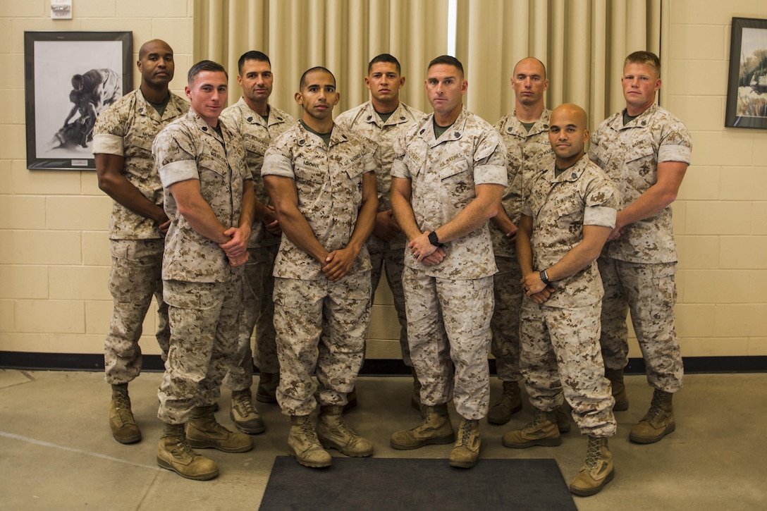 Graduates of the first Force Fitness Instructor Course pose at their graduation at the Force Fitness Readiness Center on Marine Corps Base Quantico, Vir, Nov. 4, 2016. The graduates will now return to their respective units and apply all that they’ve learned over the five-week course. (U.S. Marine Corps photo by Sgt. Jacky A. Fang/RELEASED)