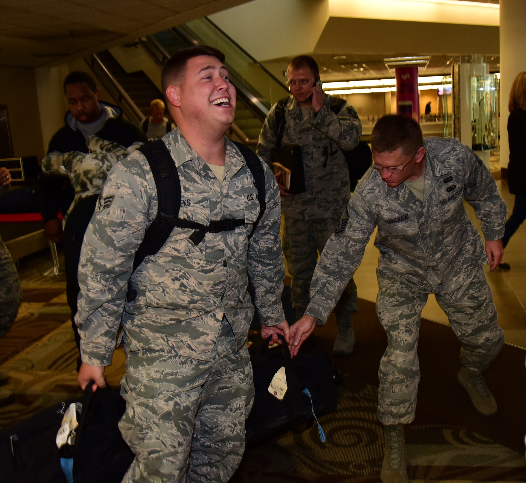 Senior Airman Tyler Meeks, a member of the 118th Security Forces Squadron, collects his bags upon returning from deployment Nov. 6, 2016 in Nashville, Tennessee. Many members of the 118th SF deployed for six months to Al Dhafra Air Base in the United Arab Emirates. 
