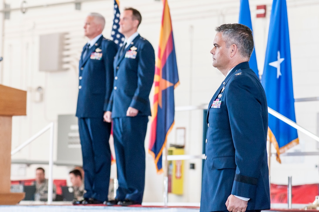 U.S. Col. Andrew J. MacDonald stands at attention as he waits to take command of the 162nd Wing, and promotion to the rank of brigadier general at a change of command ceremony in Tucson, Ariz., Nov. 5, 2016.  The 162nd Wing honors a military tradition dating back to the 18th Century that represents a format transfer of authority and responsibility for a unit from one commanding officer to another.  (U.S. Air National Guard photo by 1st Lt. Lacey Roberts)