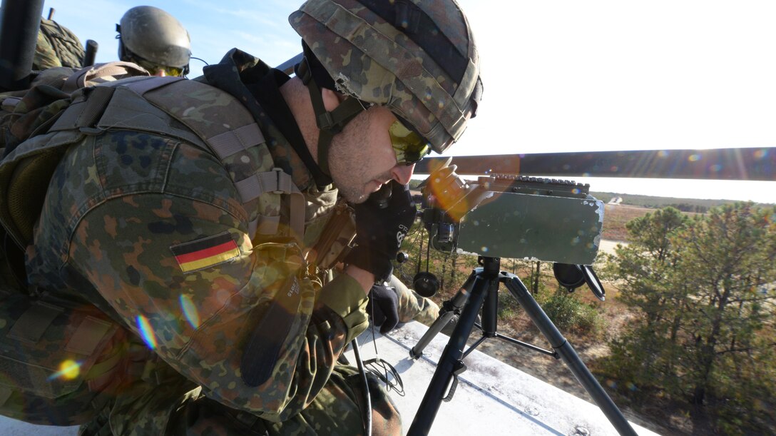 German armed forces Joint Terminal Attack Controller 1st Lt. Andreas Bier operated a laser designator to illuminate targets during close air support (CAS) training with F-16 fighter pilots from the 177th Fighter Wing at the Warren Grove Bombing Range in Ocean County, N.J. on Oct. 26, 2016. The German JTACs partnered with the New Jersey Air National Guard's 227th Air Support Operations Squadron for a second time in 2016 for a five day combined training exercise which included the CAS training with F-16s and training in the 227th's state of the art $1.2 million Air National Guard Advanced JTAC Training System.  (U.S. Air National Guard photo by Master Sgt. Andrew J. Moseley/Released)