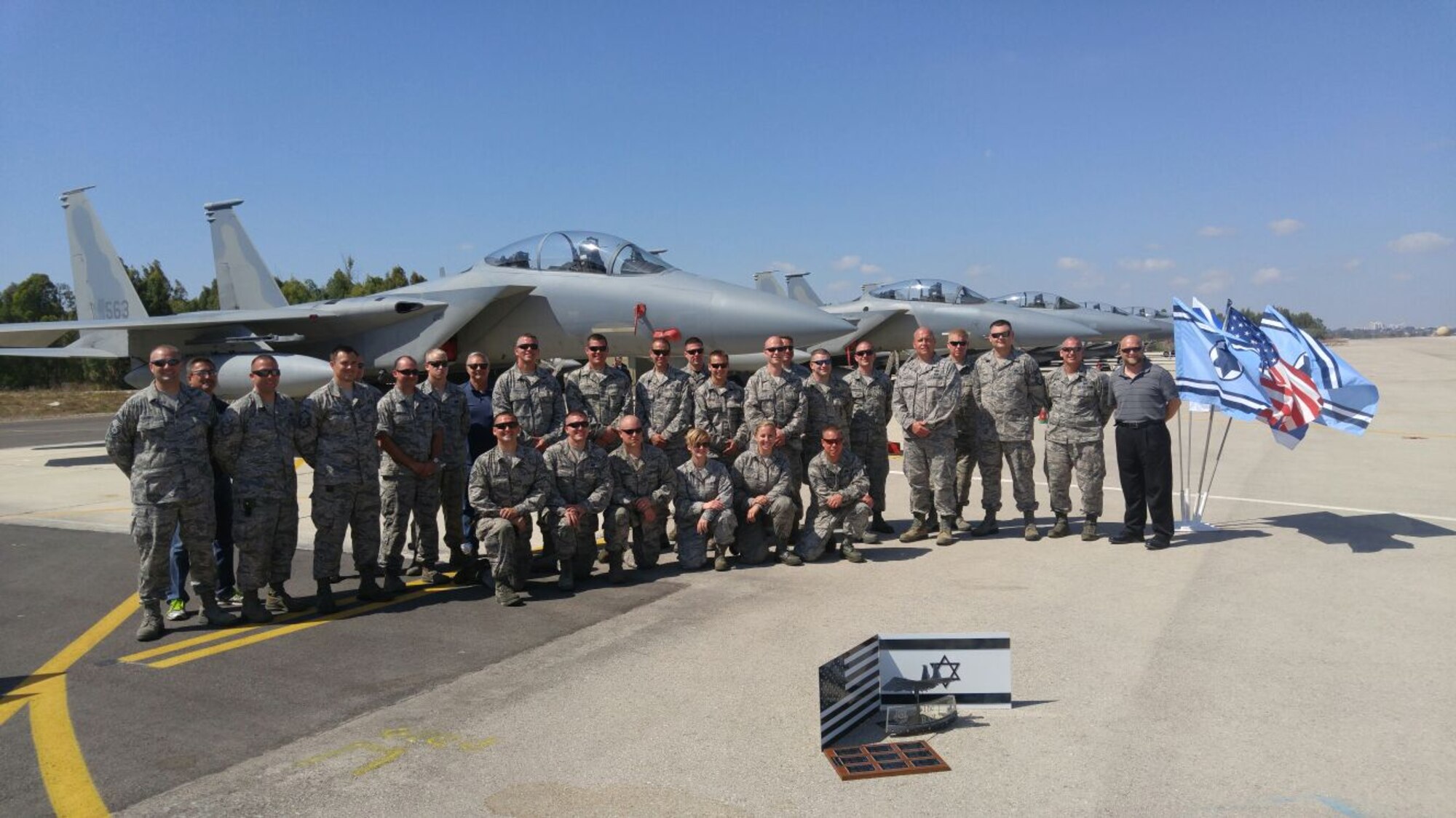 Airmen from the 173rd Fighter Wing, Oregon Air National Guard, pose with for a group photo in front of the just delivered F-15 Eagles at Tel Nof air base in Israel.  After two years of planning and final execution, the wing participated in a historic active ramp to ramp transfer of aircraft.  (U.S. Air National Guard photo by Master Sgt. Michael Shirar)