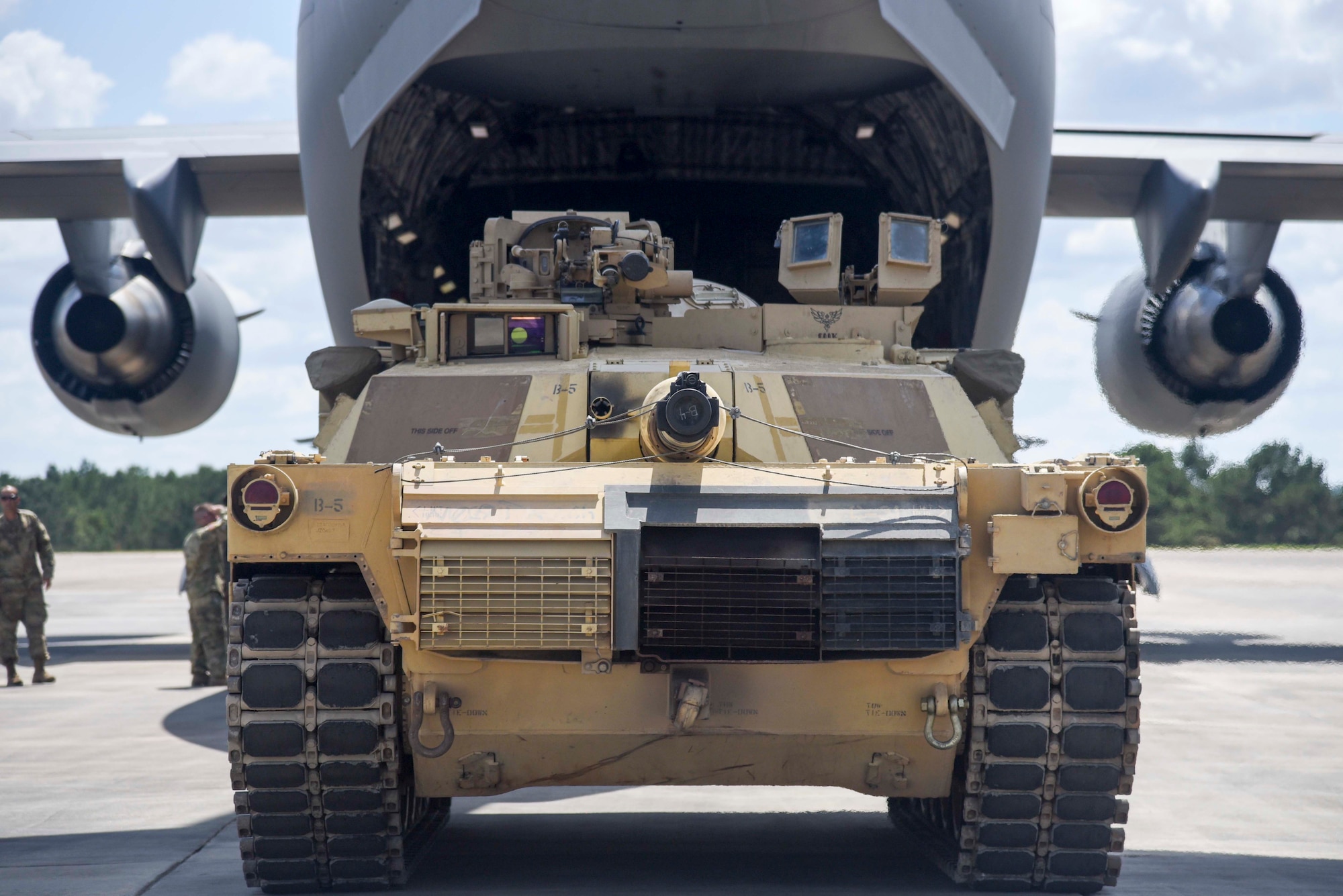 Members of the 164th Air Lift Wing in Memphis and the 278th Armored Cavalry Regiment in Knoxville prepare to load M1 Abrams for transport to 5th Canadian Division Support Base Gagetown, Canada. The 278th ACR was invited to compete in the 2016 Worthington Challenge. (US Air Force photo by Senior Airman Leon Bussey / Released)