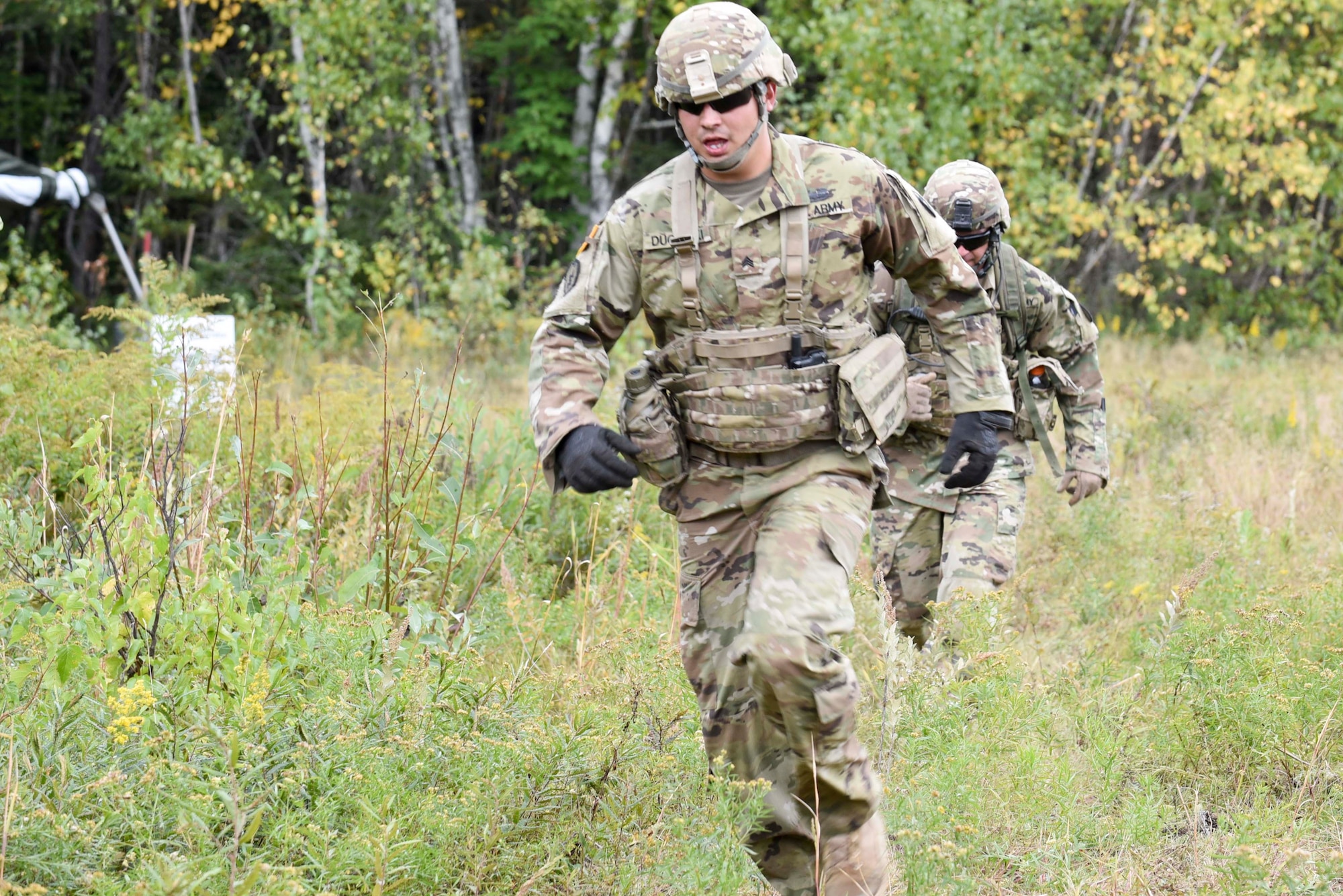 Sergeant Rayn Duginski and Staff Sergeant Wealey Goff of the 278th Armored Cavalry Regiment in Knoxville, Tenn., run towards the finishline during the land navigation and observation section of the Worthington Challenge.The Worthington Challenge is an internatoinal armored crew competition, hosted by the Canadian Army, focused on showing armed crew skills as well as sharing best training practices amongst allies.(US Air Force photo by Senior Airman Leon Bussey / Released)
