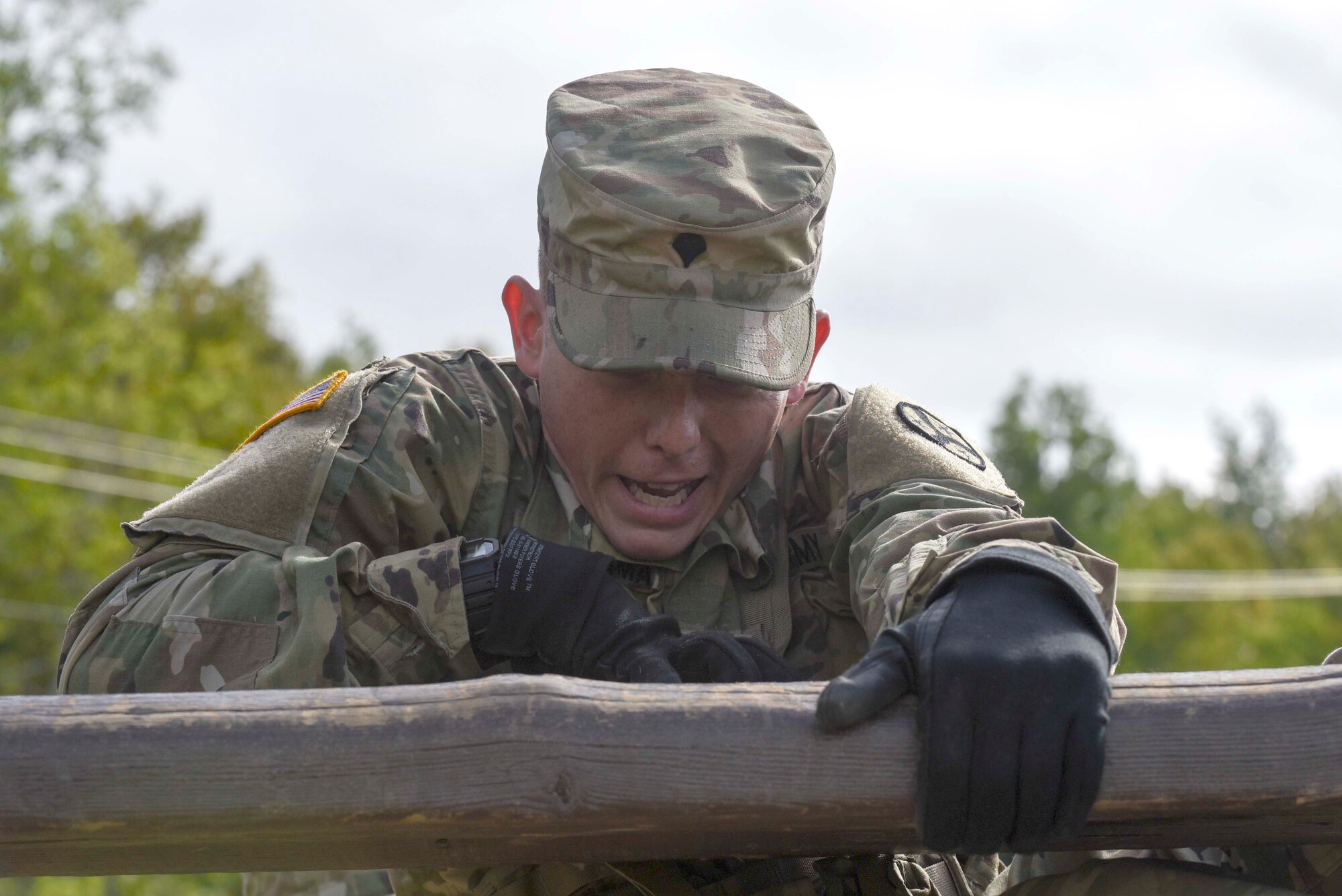 Specialist James Creasman, a Armor Vehicle Crewman with the 278th Armored Cavalry Regiment in Knoxville, pulls himself over an obstacle while preparing for the march and shoot section of the Worthington Challenge. The Worthington Challenge is an internatoinal armored crew competition, hosted by the Canadian Army, focused on showing armed crew skills as well as sharing best training practices amongst allies.(US Air Force photo by Senior Airman Leon Bussey / Released)