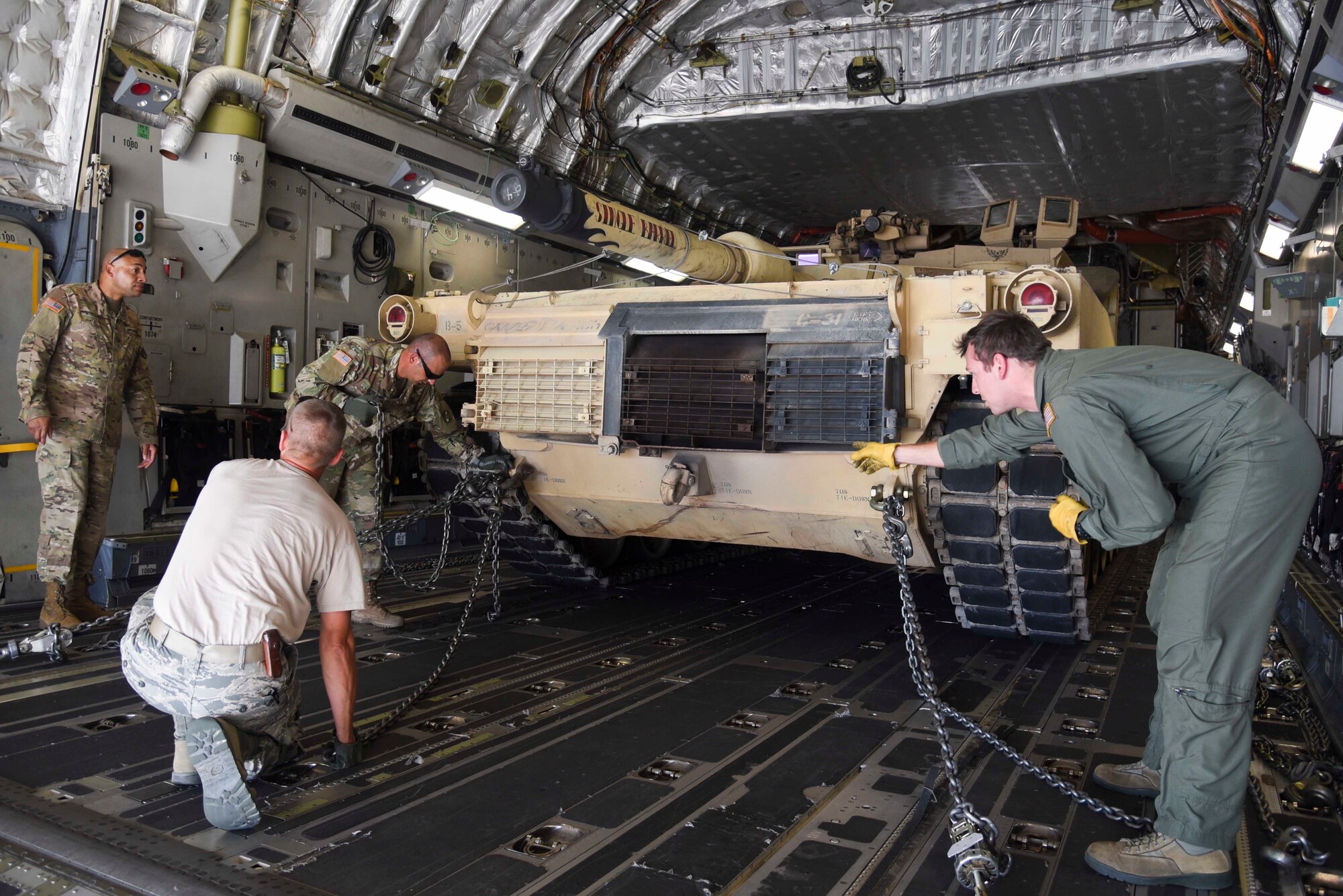 Members of theNorth Carolina National Guard  assist members of the 164th Air Lift Wing with chaining down a M1 Abrams in the cargo bay of a C-17 Globemaster III. As the winners of the Sullivan Cup, the North Carolina National Guard was invited to compete in the 2016 Worthington Challenge. (US Air Force photo by Senior Airman Leon Bussey / Released)