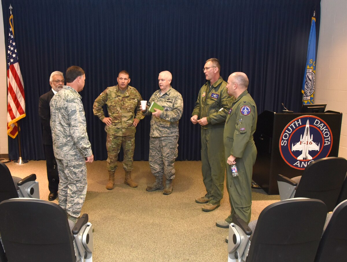 Lt. Gen. L. Scott Rice, Air National Guard Director, and Maj. Gen. Timothy Reisch, the Adjutant General, South Dakota National Guard, speak to senior leaders of the South Dakota Air National Guard, Nov. 5, 2016. Rice and Reisch toured base facilities and participated in a recognition ceremony during their visit to Joe Foss Field.