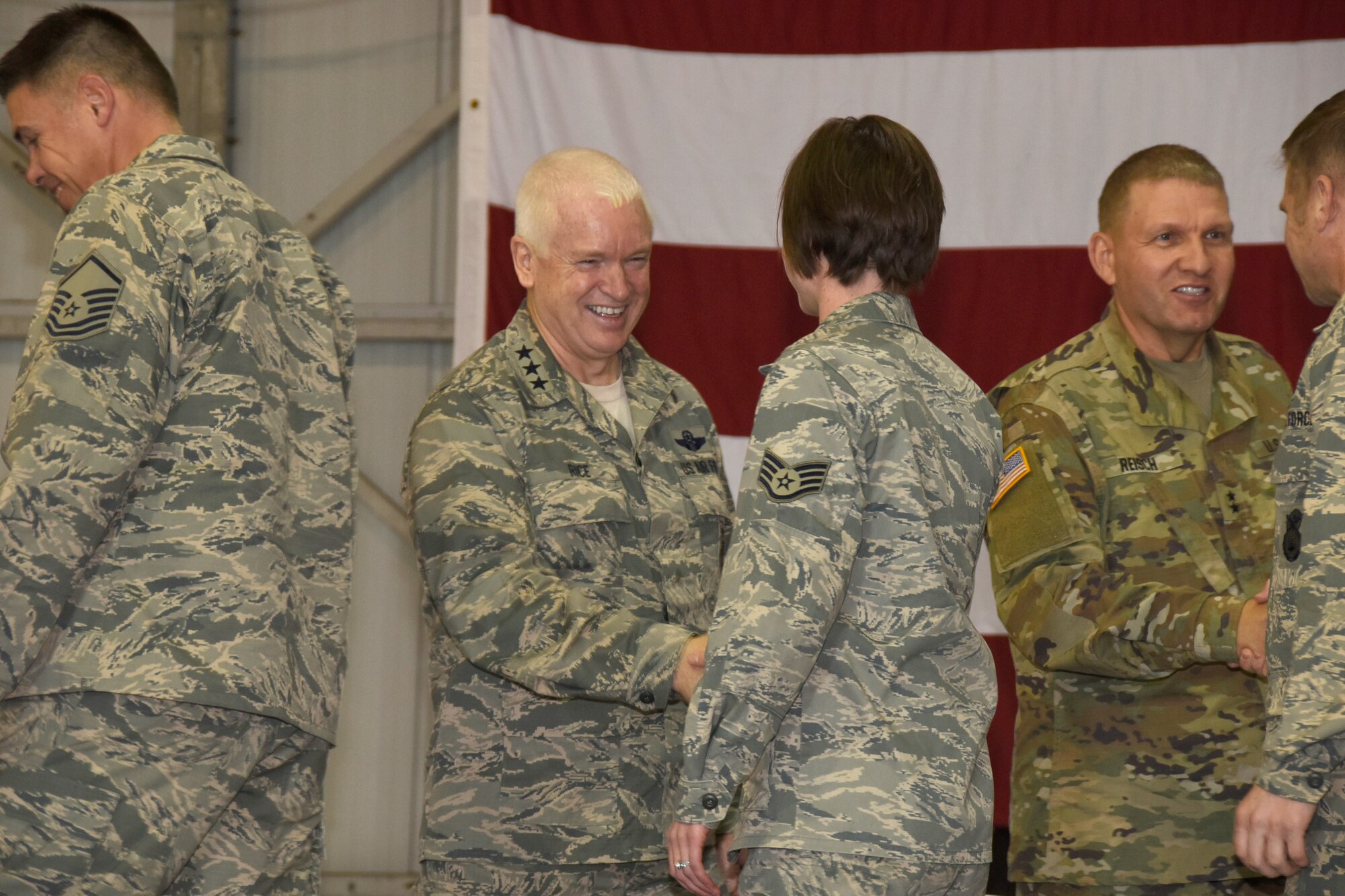 Lt. Gen. L. Scott Rice, Air National Guard director, and Maj. Gen. Timothy Reisch, the Adjutant General, South Dakota National Guard, shake hands with Airmen from the 114th Fighter Wing during a recognition ceremony, Nov. 5, 2016. Rice and Reisch also toured base facilities during their visit to the South Dakota Air National Guard. (U.S. Air National Guard photo by Tech. Sgt. Luke Olson/Released)