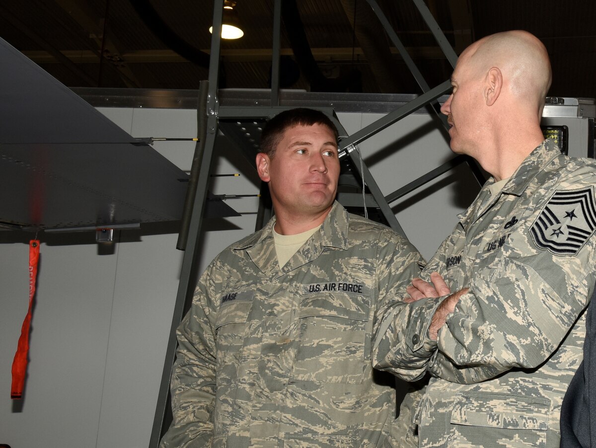Chief Master Sgt. Ronald C. Anderson, Air National Guard command chief master sergeant, visits with Technical Sgt. Ryan Haase, 114th Maintenance Squadron fuel systems mechanic, during his visit to Joe Foss Field, Nov. 6, 2016.  As the highest level of enlisted leadership, Chief Anderson is responsible for matters influencing the health, morale, welfare and professional development of more than 105,400 Air Guard members.  (U.S. Air National Guard Photo by Master Sgt. Chris Stewart /Released)