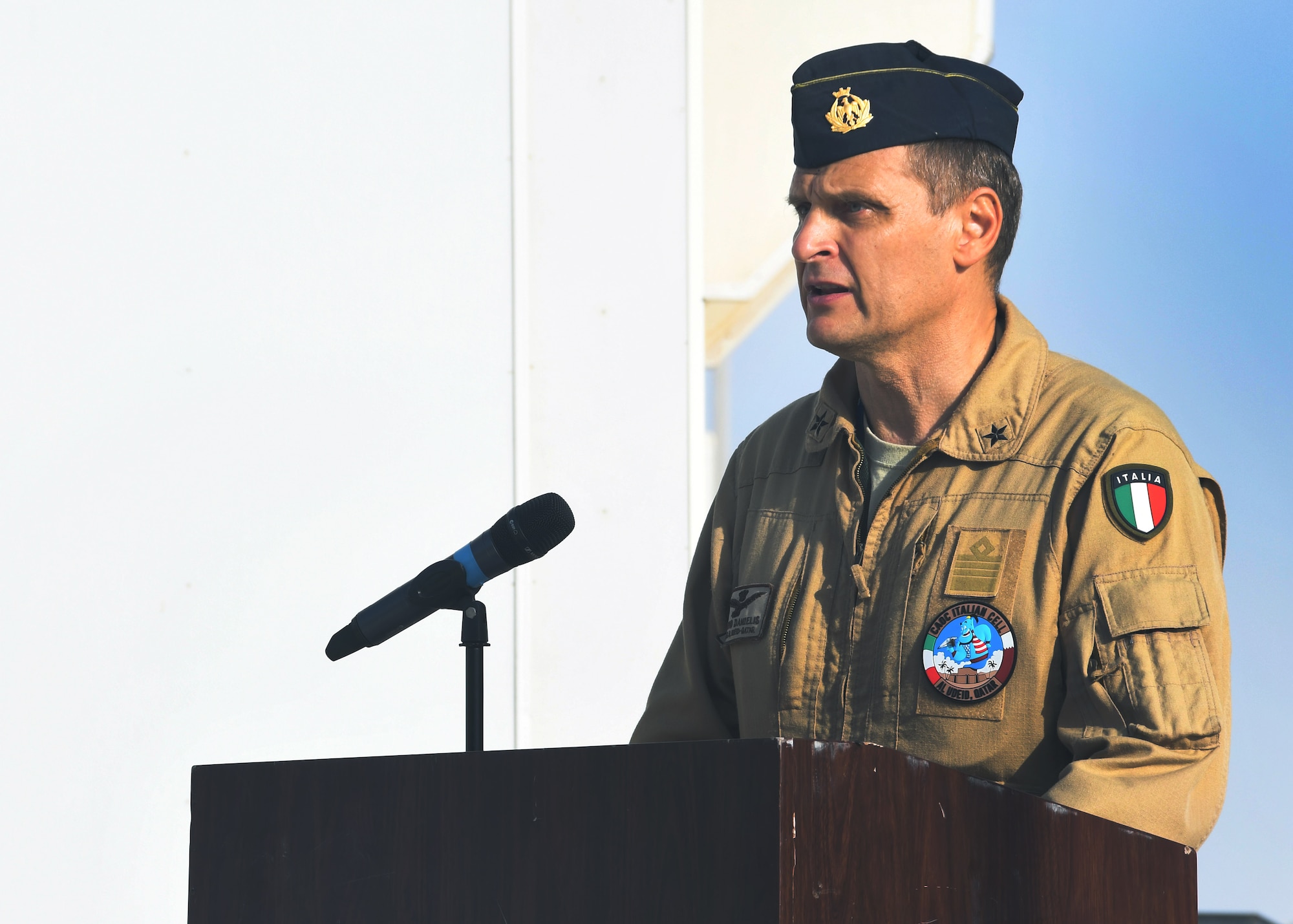 Col. Flavio Danielis, Italian Detachment senior officer at the Combined Air Operations Center, speaks during the Italian Armed Forces Day ceremony at Al Udeid Air Base, Qatar Nov. 4, 2016. The Italian Detachment, as well as representatives from Qatar, Air Forces Central Command, the 379th Air Expeditionary Wing and other agencies, gathered at the Memorial Plaza to commemorate the day of remembrance and to give their time and thanks to those who served and currently serve in the Armed Forces. (U.S. Air Force Photo by Senior Airman Miles Wilson)
