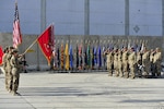 BAGRAM AIRFIELD, AFGHANISTAN (Nov. 2, 2016) - The color guard, dignitaries, and guests render honors to the flag during the national anthem at the transfer of authority ceremony from 2nd Battalion, 44th Air Defense Artillery Regiment to the 5th Battalion, 5th Air Defense Artillery Regiment.  The ADA battalion provides counter rocket, artillery, and mortar protection to Bagram Airfield.  Photo by Bob Harrison, U.S. Forces Afghanistan Public Affairs.