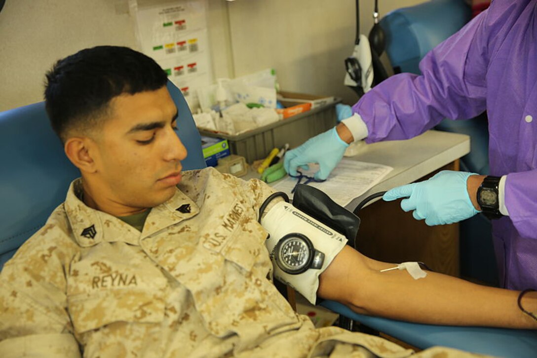 Marine Sgt. Reyna gives blood to save lives.  The Armed Services Blood Program asks you to participate in this year's Army-Navy Blood Donor Challenge Nov. 3 through Dec. 6 to not only save lives, but also to vote for your service to win bragging rights as champions for the year.  (Courtesy photo)