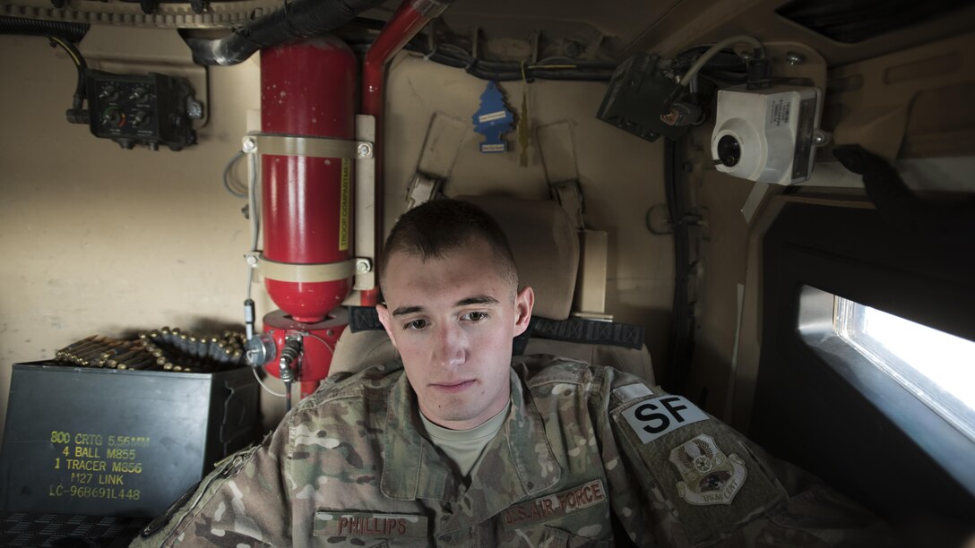 Senior Airman Tyler Phillips, 451st Expeditionary Support Squadron response force member, monitors a Common Remotely Operated Weapon System II in mine-resistant, ambush-protected all-terrain vehicle at Kandahar Airfield, Afghanistan Nov. 5, 2016. The CROWS system is required to be monitored at all times during each 12-hour shift. (U.S. Air Force photo by Staff Sgt. Katherine Spessa)
