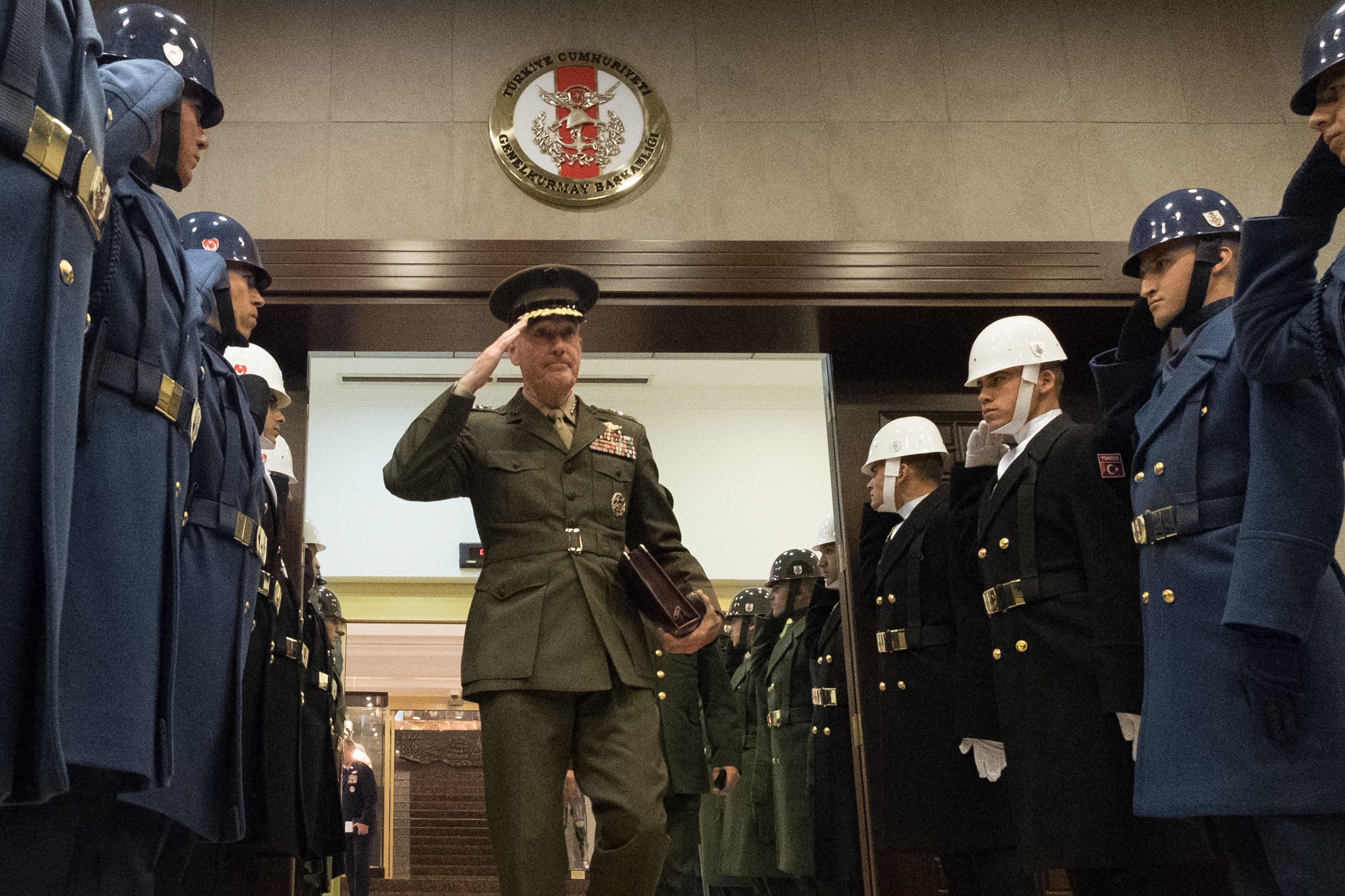 Marine Corps Gen. Joe Dunford, chairman of the Joint Chiefs of Staff, salutes Turkish honor guard members.