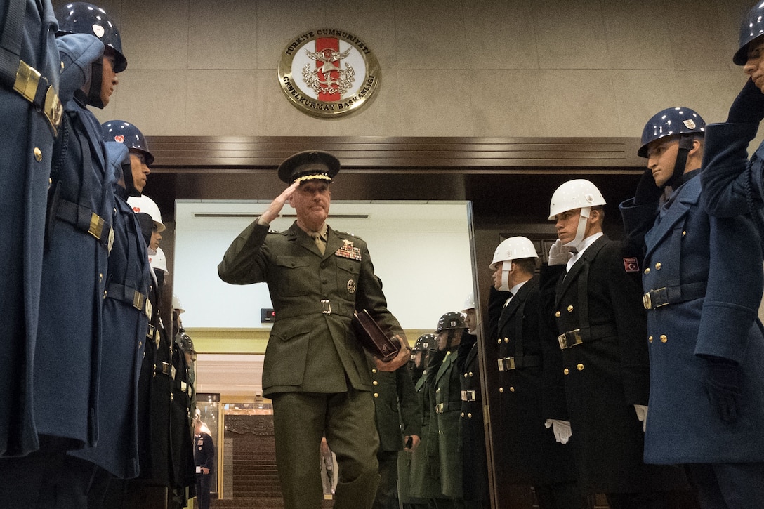 Marine Corps Gen. Joe Dunford, chairman of the Joint Chiefs of Staff, salutes Turkish honor guard members after meetings at the Ministry of National Defense in Ankara, Turkey, Nov. 6, 2016. DoD photo by D. Myles Cullen
