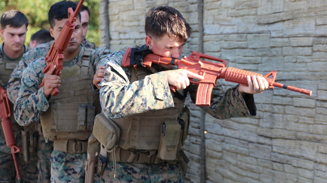 Military policemen from the 24th Marine Expeditionary Unit's law enforcement detachment patrol through an urban environment Nov. 2, 2016. The Marines received advanced training in tactics, techniques and procedures in urban patrolling and combat skills during the MEU's Realistic Urban Training exercise from critical skills operators from Marine Corps Forces, Special Operations Command.