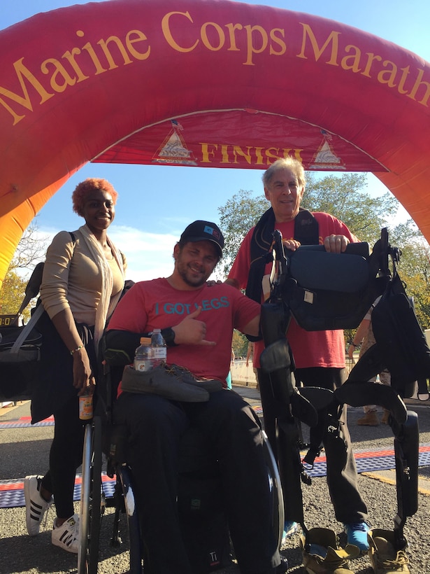 Adam Gorlitsky of Mount Pleasant, South Carolina, poses with his exoskeleton, which assisted him in completing the last 6.2 miles of the Marine Corps Marathon. Gorlitsky suffered a tragic car accident 11 years ago which left him paralyzed from the waist down. He founded an organization called IGotLegs.org to bridge the gap between awareness and support to veterans on the road to recovery.