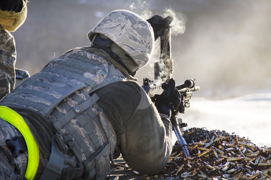 Air Force Airman 1st Class Isaiah McKee clears a M240B machine gun during a live-fire training at Grezelka range, Joint Base Elmendorf-Richardson, Alaska, Oct. 27, 2016. McKee is an installation entry controller assigned to the 673rd Security Forces Squadron. Air Force photo by Alejandro Pena