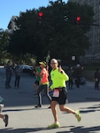 Senior Master Sgt. Todd Kirkwood, 167th avionics superintendent, gives a thumbs up at mile 25 of the Chicago Marathon, Oct. 9, 2016. Kirkwood ran the marathon only eight months after undergoing chemotherapy and radiation treatments for cancer.