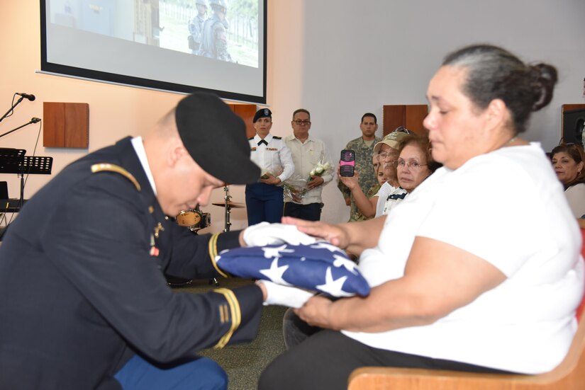 Army Reserve Soldiers from the 301st Military Police Company, family and friends gathered at the Fort Buchanan Chapel for a Memorial Service in honor of Sgt. Anthony William Bakogiannis, on November 5.  During the Memorial Service, an American flag was presented to his mother, Raquel Quinones Reyes.