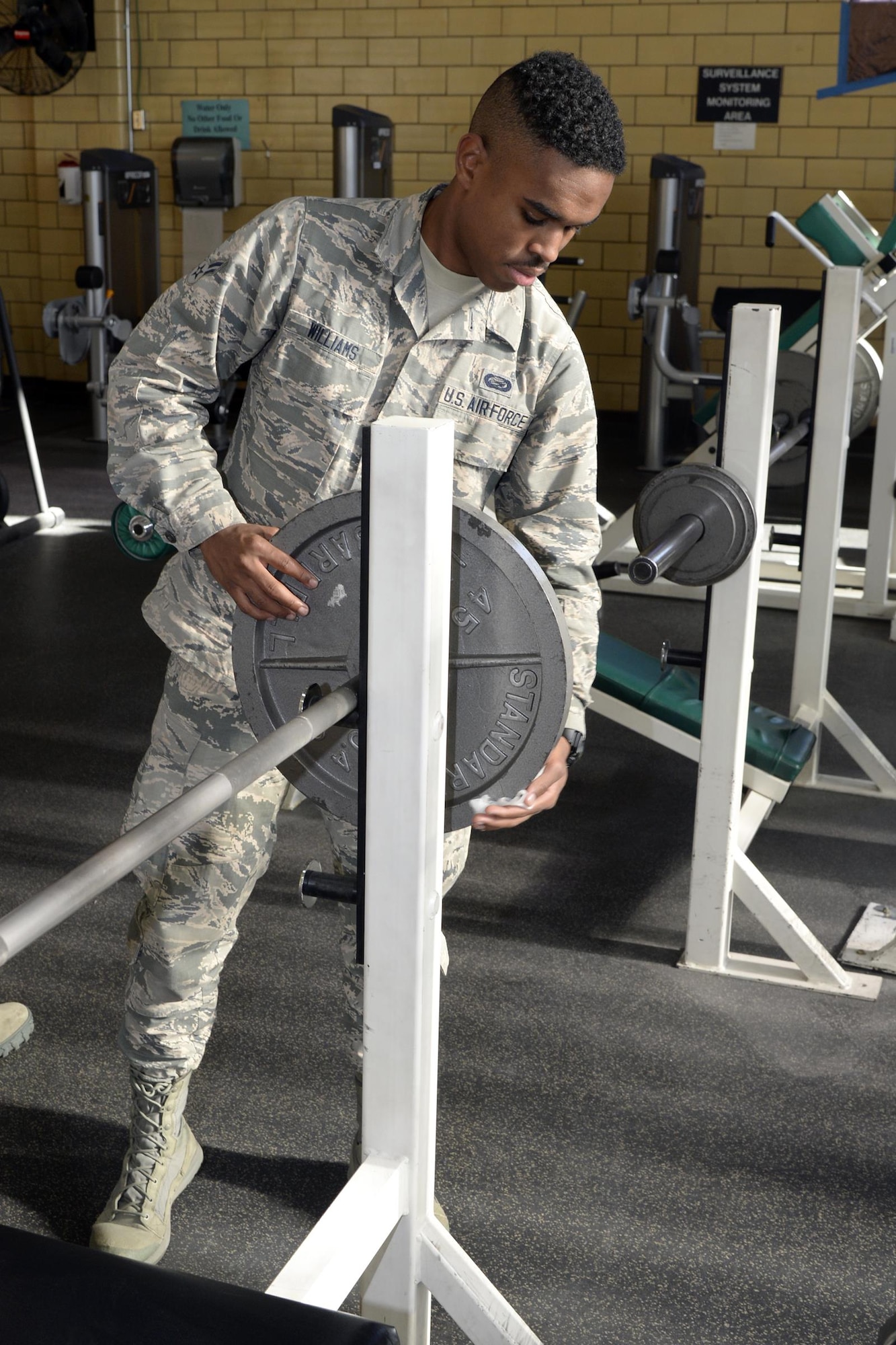 Airman 1st Class Terrell Williams, 75th Force Support Squadron, cleans workout equipment at the George E. Whalen Veterans Affairs Medical Center in Salt Lake City, Nov. 3. Hill Air Force Base Airmen teamed up with community partners for the Department of Defense’s annual ‘Commitment to Service’ project, an enterprise aimed at bettering communities across the nation. (U.S. Air Force photo by Todd Cromar)