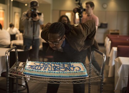 Veteran Reginald "Reggie" Des’Ravines blows out candles during a surprise dream day experience at Johnson and Wales University, Charlotte, N.C. Reggie received a VIP shopping experience at Sur La Table and opportunity to serve distinguished guests with his personal menu at The Fig Tree restaurant, Oct 27. (U.S. Army Reserve Photo by Sfc. Brian Hamilton, 108th Training Command (IET), Public Affairs)