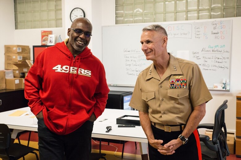Lieutenant General Rex C. McMillian, commander of Marine Forces Reserve and Marine Forces North and Guy McIntyre, retired offensive lineman from the 49ers and director of alumni relations, discuss the history of the 49ers at Levi’s Stadium, Nov. 4, 2016.  McMillian was invited to observe a 49ers’ practice session in preparation for Sunday’s “Salute to Service” game against the New Orleans Saints at Levi’s Stadium. The half-time show of Sunday’s game will recognize the Marine Forces Reserve Centennial. Today, approximately 500 Reserve Marines are providing fully integrated operational support to Fleet and Combatant Commanders around the world. For more information on the history and heritage Marine Forces Reserve as well as current Marine stories and upcoming Centennial events, please visit www.marines.mil/usmcr100. (U.S. Marine Corps photo by Lance Cpl. Dallas Johnson)