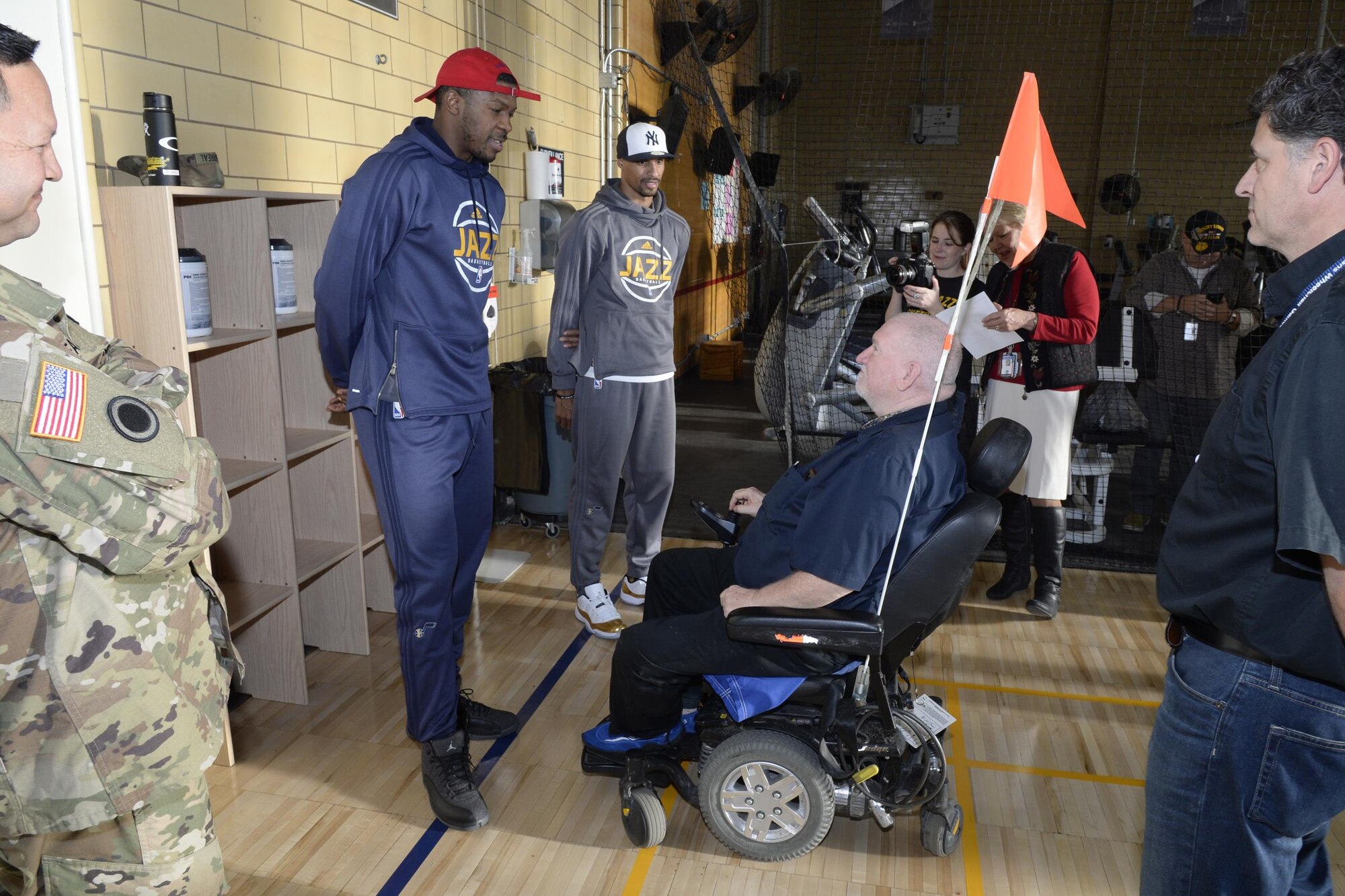 Utah Jazz players Derrick Favors and George Hill visit with a veteran at the newly remodeled gymnasium at the George E. Whalen Veterans Affairs Medical Center in Salt Lake City during the annual NBA/Department of Defemnse service project called ‘Commitment to Service,’ Thursday, Nov. 3, 2016. (U.S. Air Force photo by Todd Cromar)