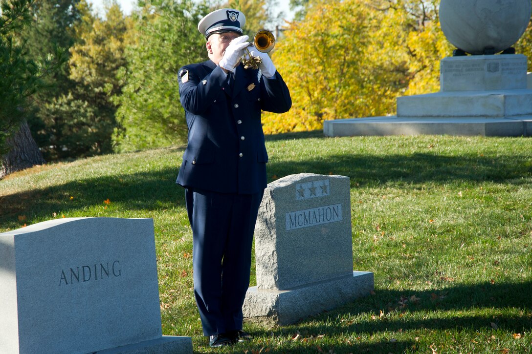 A bugler assigned to the Coast Guard Auxiliary plays taps at the Flags Across America event at Arlington National Cemetery, Arlington, Va., Nov. 5, 2016. Coast Guard photo by Petty Officer 2nd Class Lisa Ferdinando