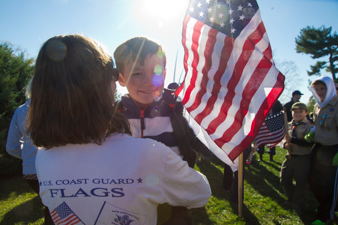 Coast Guard families take part in the annual Flags Across America event at Arlington National Cemetery, Arlington, Va., Nov. 5, 2016. Coast Guard photo by Petty Officer 2nd Class Lisa Ferdinando
