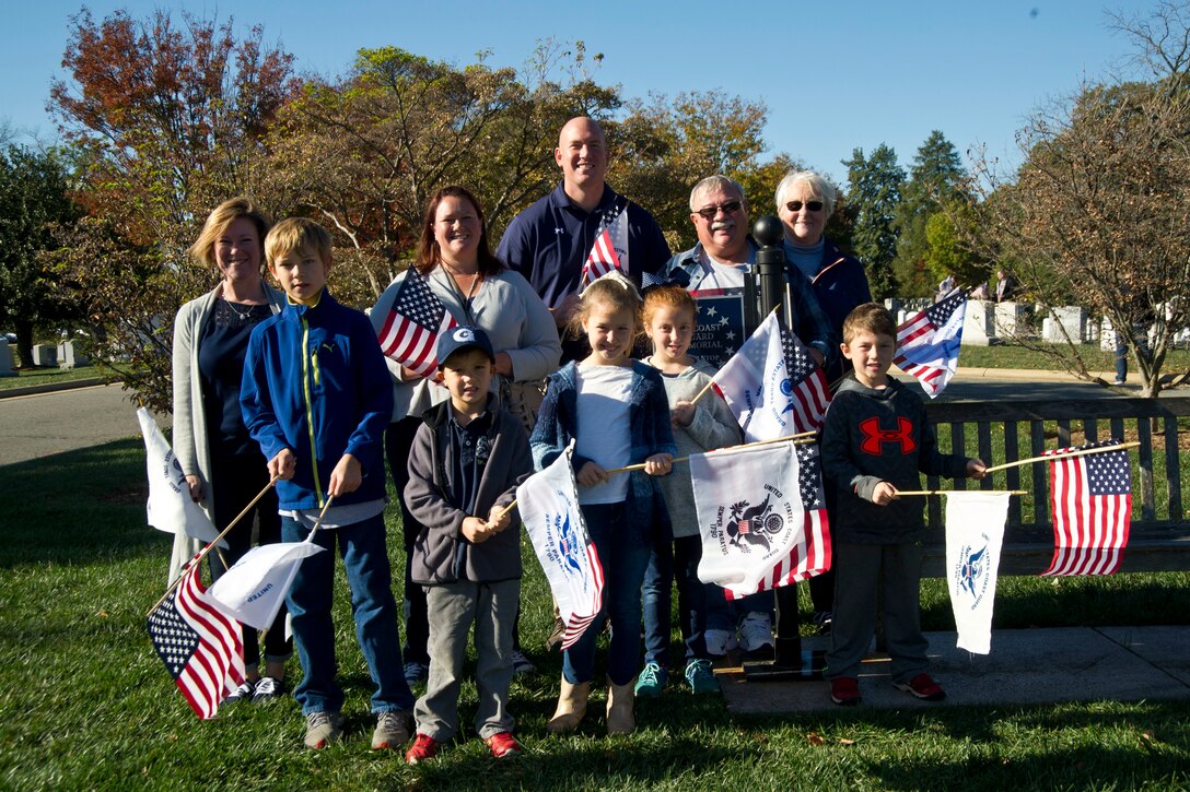 Coast Guard families participate in the Flags Across America event at Arlington National Cemetery, Arlington, Va., Nov. 5, 2016. Coast Guard photo by Petty Officer 2nd Class Lisa Ferdinando