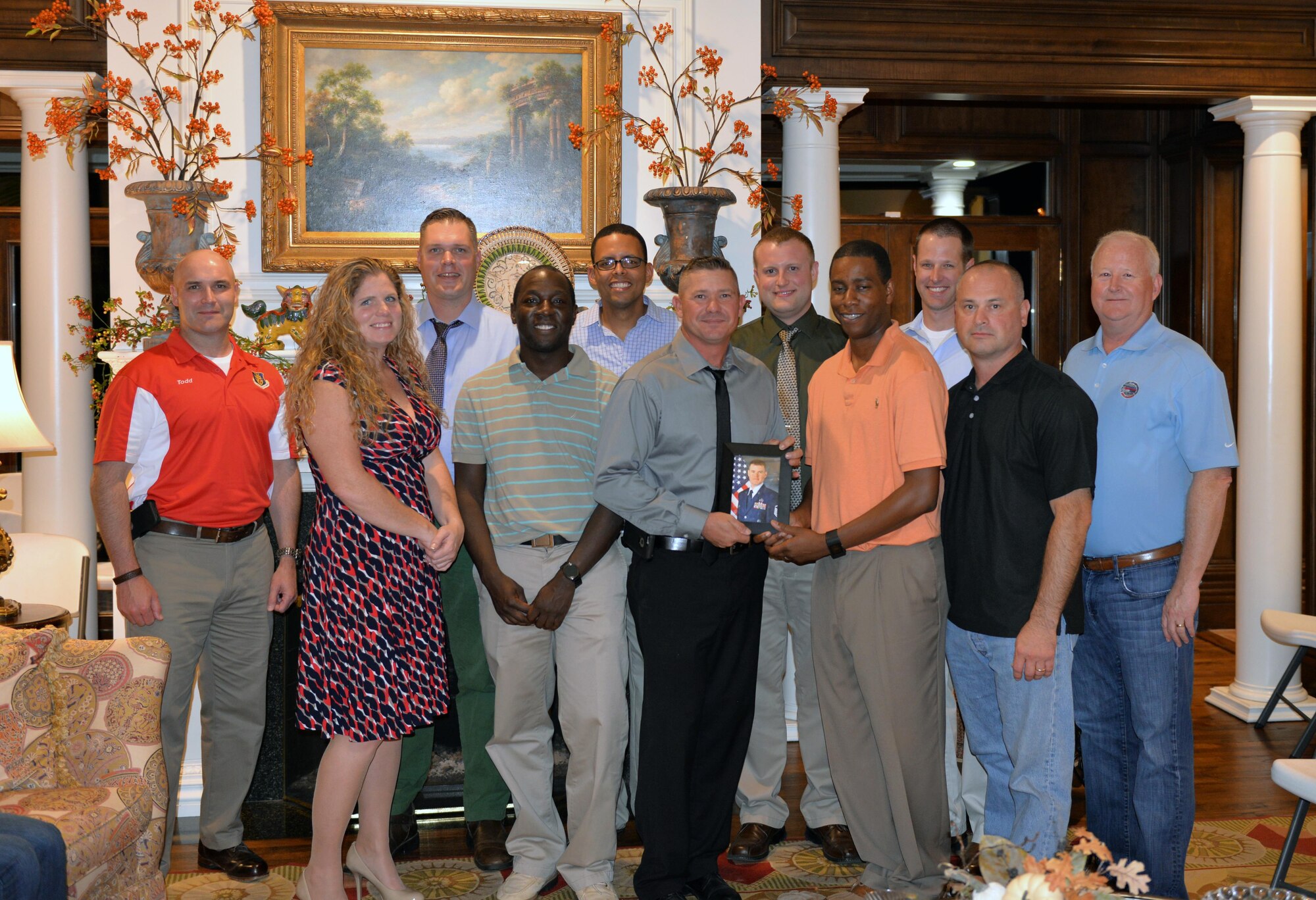 U.S. Air Force Col. Todd Hohn, Commander of the 97th Air Mobility Wing, Dr. Joe Leverett, Chairman of the Altus Military Affairs Committee, and first sergeants from the Mighty 97th pose for a group photo at the 16th annual First Sergeants Dinner, Oct. 6, 2016. The event, sponsored by the local Military Affairs committee, honors first sergeants for the work they perform for the Airmen at Altus Air Force Base. (U.S. Air Force Photo by  Kenneth Scarle / Released) 