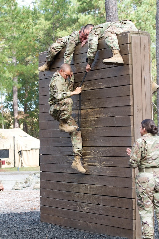 Basic Combat Training Soldiers from Company A, 34th Infantry Regiment, complete the five walls obstacle at the confidence course during their fifth week of training at Fort Jackson, S.C., Oct 19. The confidence course promotes team building and confidence in soldiers individually. (U.S. Army Reserve photo by Spc. Tynisha L. Daniel, 108th Training Command)