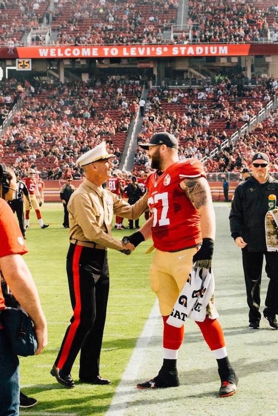 Lieutenant General Rex C. McMillian, commander of Marine Forces Reserve and Marine Forces North, is greeted by San Francisco 49ers’ center Daniel Killgore at Levi’s Stadium, Nov. 6, 2016 during the MARFORRES Centennial celebration. McMillian was the National Football League’s guest of honor at the game as part of its “Salute to Service” campaign. Today, approximately 500 Reserve Marines are providing fully integrated operational support to Fleet and Combatant Commanders around the world.  For more information on the history and heritage of the Marine Forces Reserve as well as current Marine stories and upcoming Centennial events, please visit www.marines.mil/usmcr100. (U.S. Marine Corps photo by Lance Cpl. Dallas Johnson)