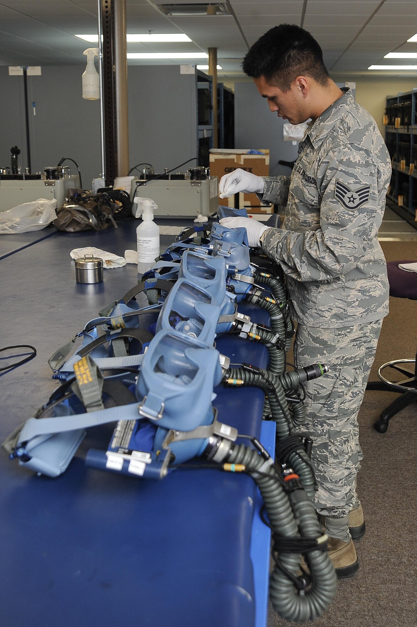 Staff Sgt. Matthew Walters, an aircrew flight equipment technician with the 6th Operations Support Squadron, inspects quick don masks at MacDill Air Force Base, Fla., Nov. 2, 2016. The oxygen equipment section inspects gear for each aircrew member to include quick don masks. (U.S. Air Force photo by Airman 1st Class Mariette Adams)