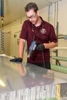 Tradd Baggott, 553rd Commodities Maintenance Squadron composite fabricator, uses a heat gun to warm adhesive between aluminum skin he is pressing down over aluminum honeycomb during a remanufacture of a KC-135 Stratotanker ruddervator at the Oklahoma City Air Logistics Complex, July 25, 2016, Tinker Air Force Base, Okla. The 553rd CMMXS manufactures and maintains components for KC-135, B-1B, B-52H, E-3 and E-6 aircraft.  (U.S. Air Force photo/Greg L. Davis)