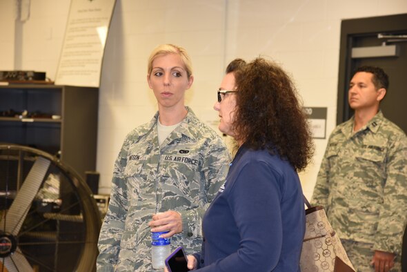 Bethany Butler, from Navy Federal Credit Union, visits with her employee, Staff Sgt. Jordan Watson, 41st Aerial Port Squadron air transportation specialist, during the 403rd Wing Employer Day, Nov. 5. The employers received a flight, tour and demonstrations of the different jobs and training that their Air Force Reserve employees do when performing military service. (U.S. Air Force photo/Master Sgt. Jessica Kendziorek) 