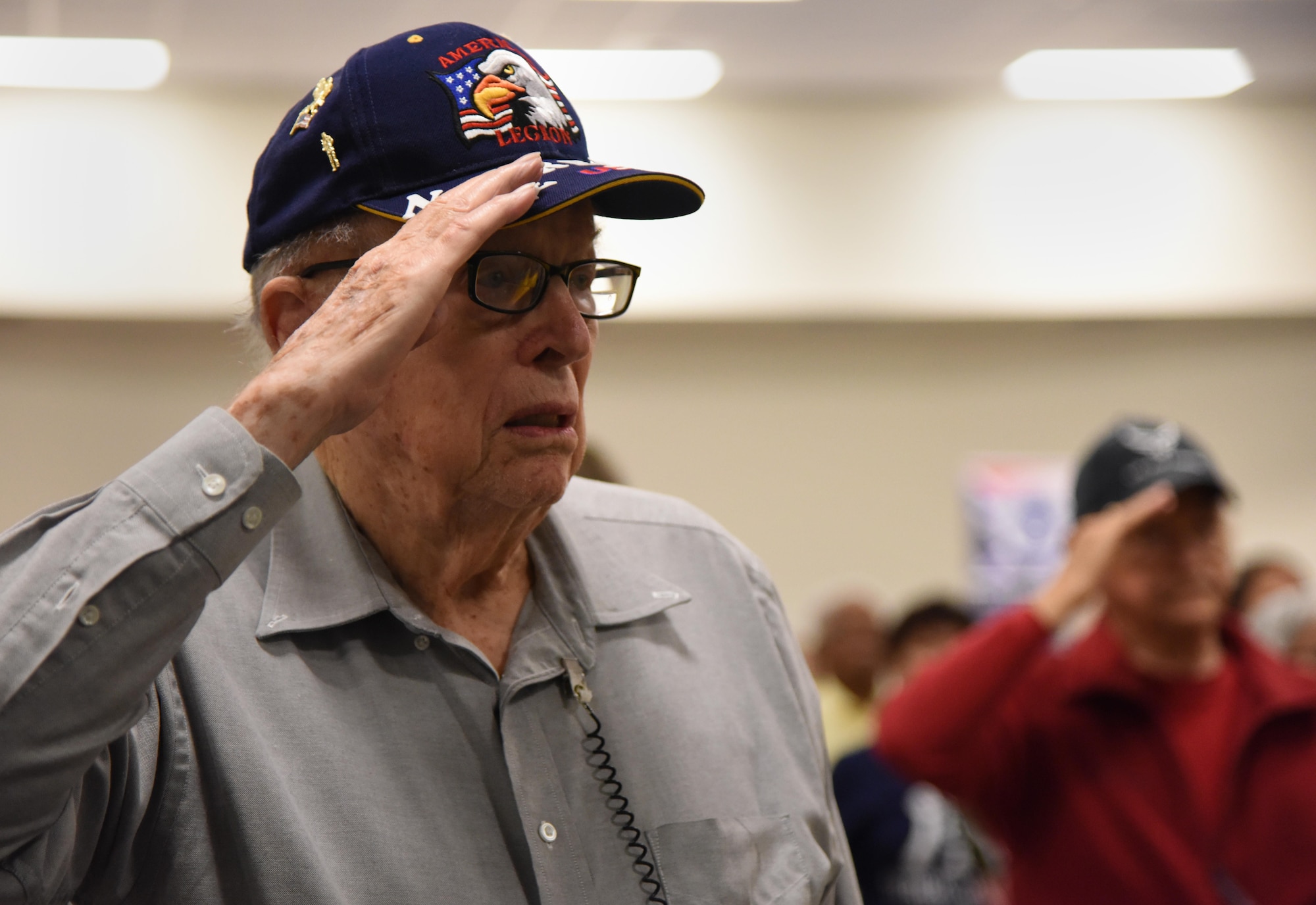 U.S. Navy retired Chief Kenneth Schneider renders a salute during the singing of the national anthem during Retiree Appreciation Day at the Roberts Consolidated Aircraft Maintenance Facility Nov. 4, 2016, on Keesler Air Force Base, Miss. The annual event, sponsored by the Keesler Retiree Activities Office, included more than 20 displays with information pertinent to retirees and a free lunch. (U.S. Air Force photo by Kemberly Groue/Released)