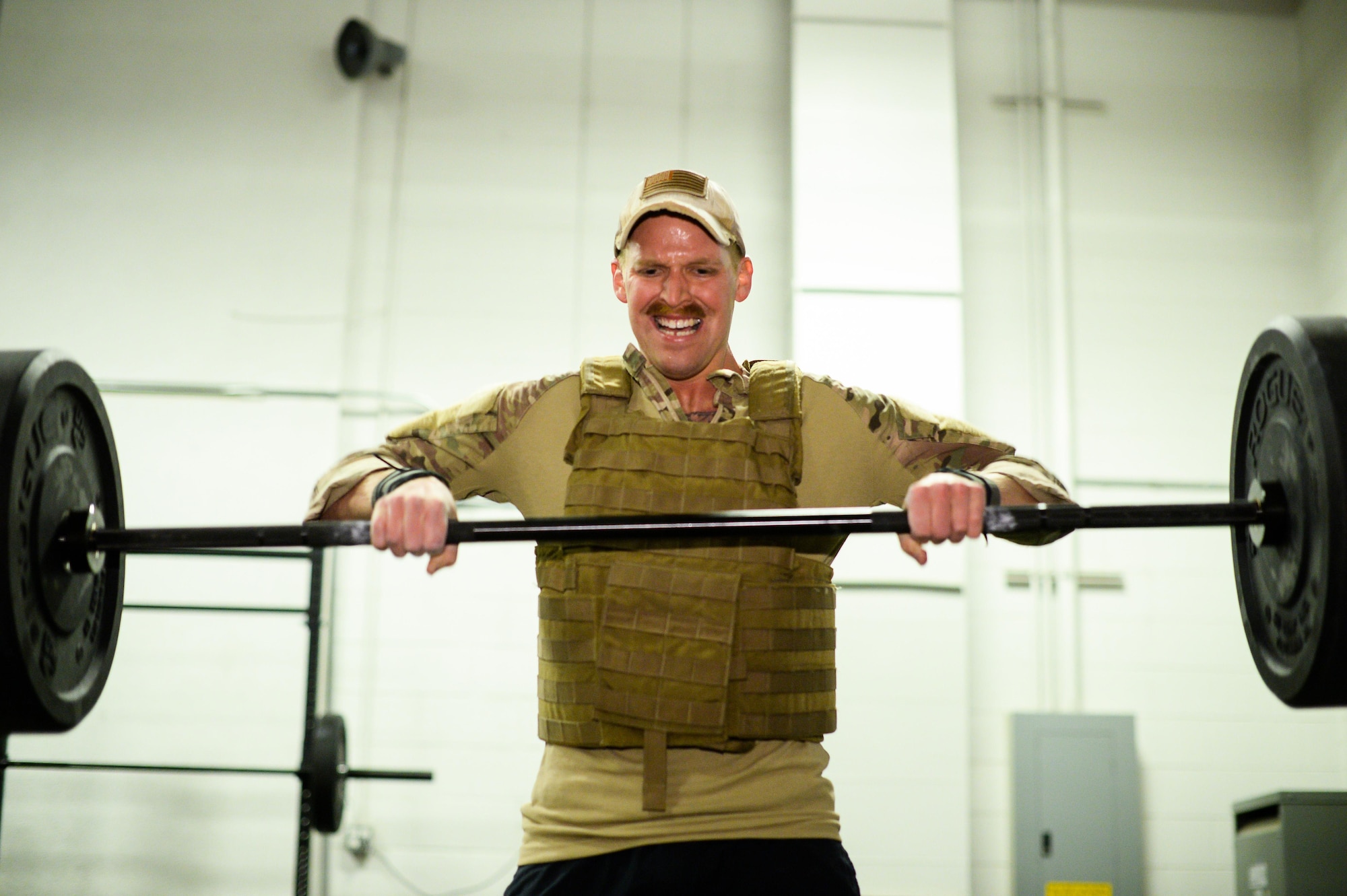 Tech. Sgt. Neal Krysinski, 775th Explosive Ordnance Disposal Flight, performs a hang clean rep during the EOD 131 Memorial Workout at Hill Air Force Base, Nov. 4. (U.S. Air Force photo by R. Nial Bradshaw) (U.S. Air Force photo by R. Nial Bradshaw)